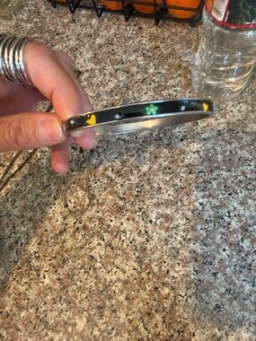 Black Enamel Bangle with Yellow Hearts and Green Flower Accent